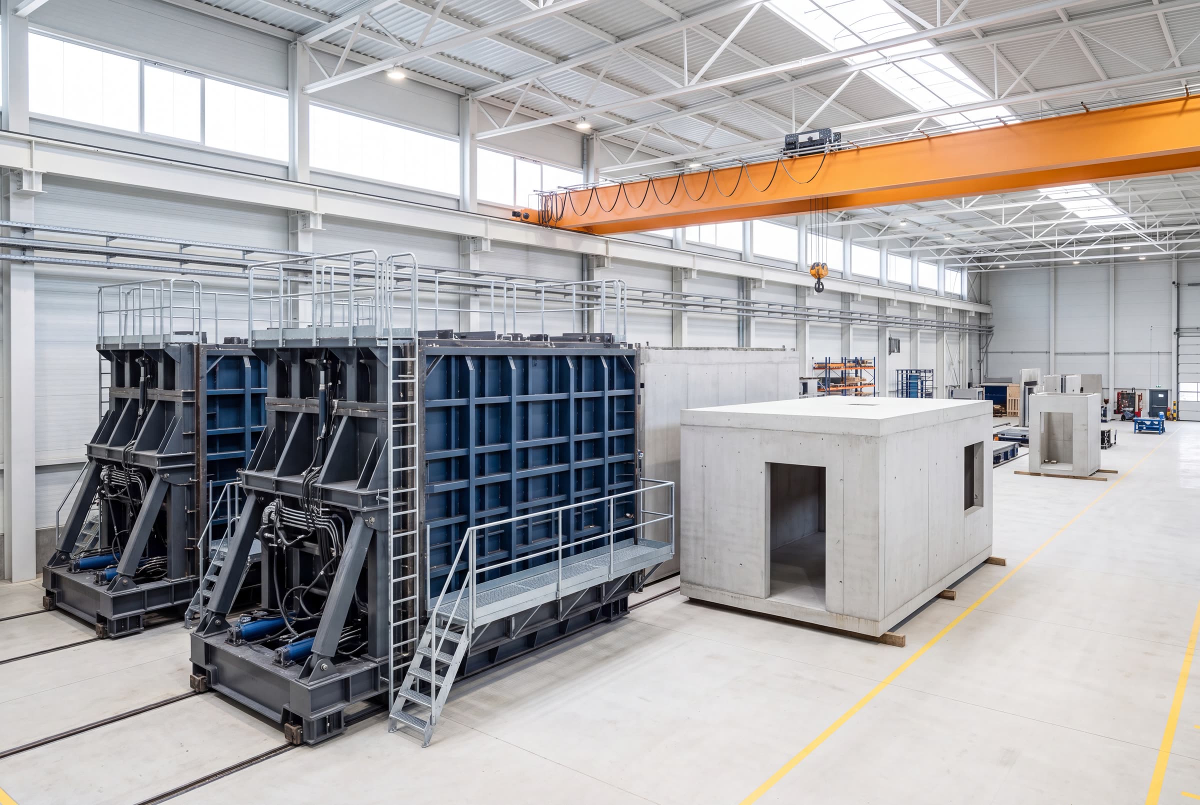 Interior of a precast manufacturing facility with hydraulic mould lines.